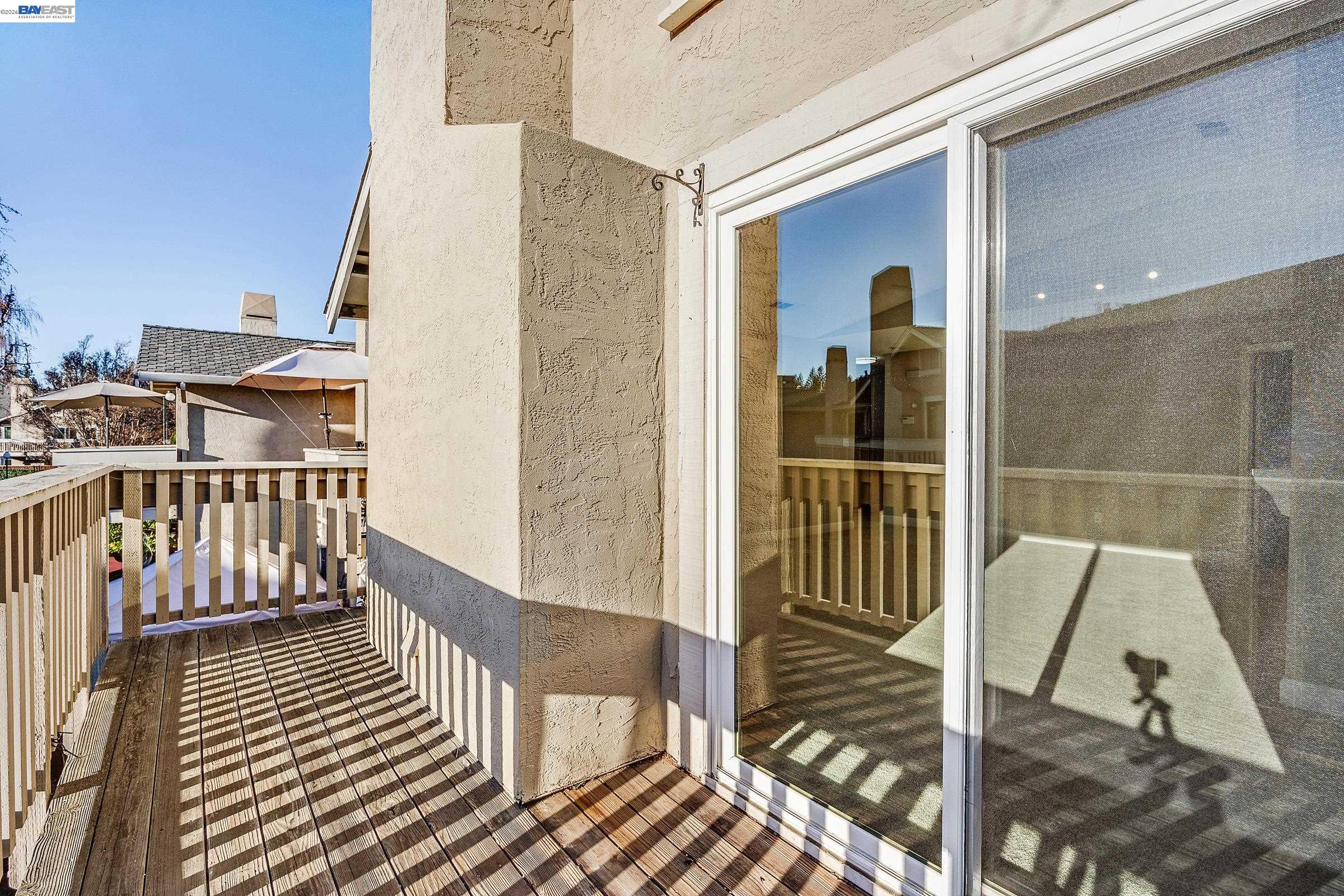3769 Crow Canyon Road San Ramon, CA 94582 - Photo 49 of 56 a view of a balcony with chair and floor to ceiling window