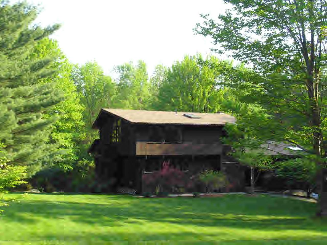 11 Rattlesnake Mountain Road Stockbridge, MA 01262 - Photo 1 of 6 a front view of a house with a garden