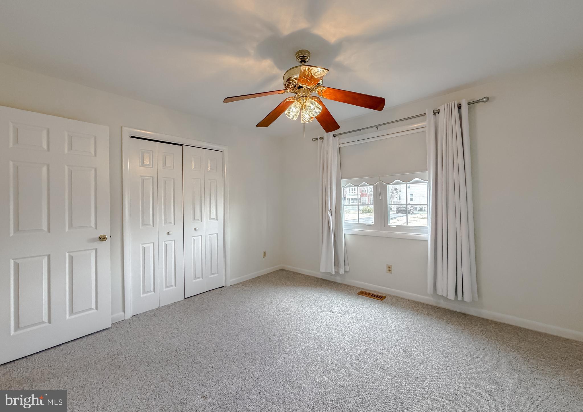 7615 Mill Creek Road Benedict, MD 20612 - Photo 21 of 37 a view of an empty room with window and cabinet