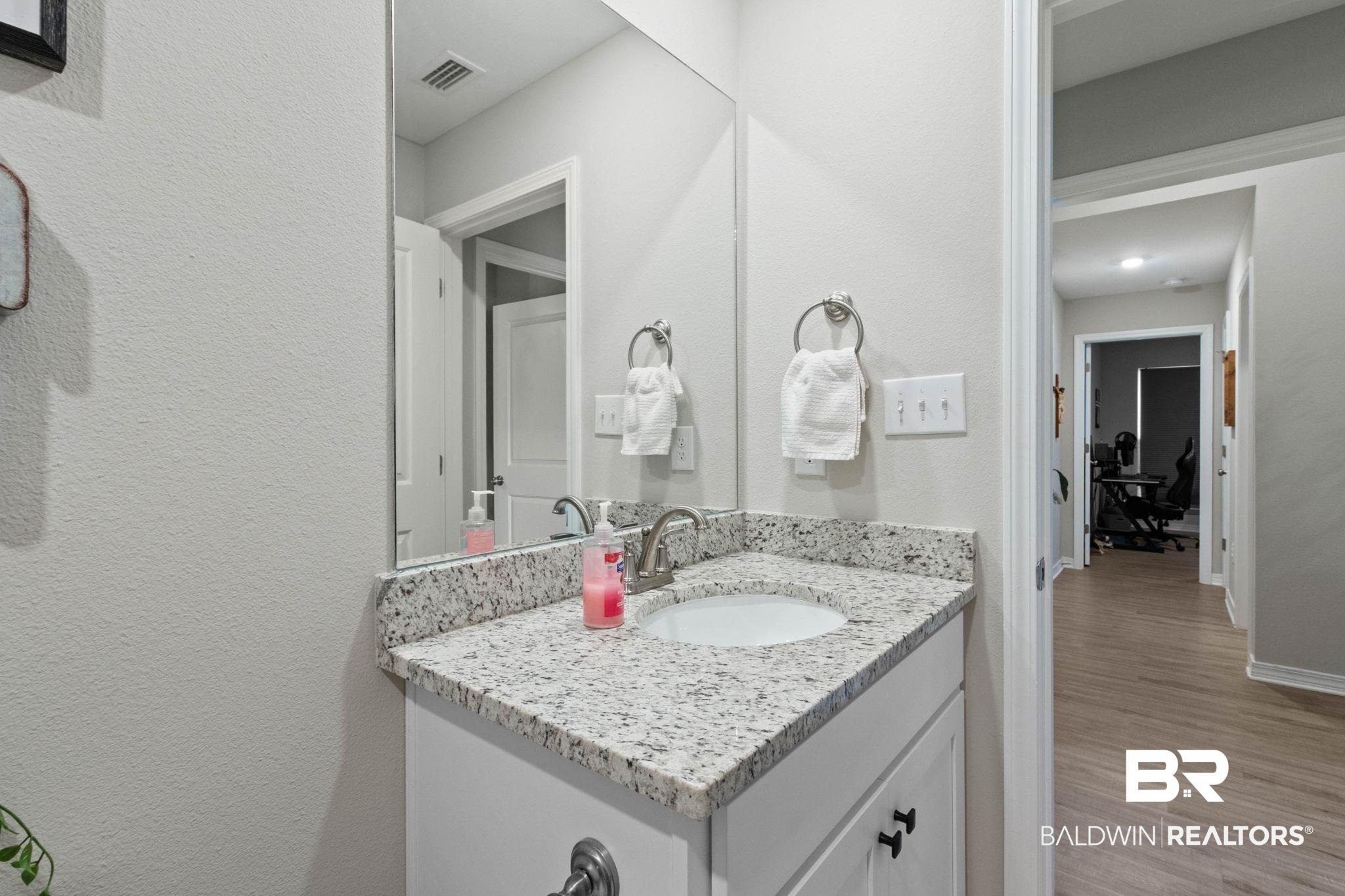 1203 Hayward Loop Foley, AL 36535 - Photo 25 of 41 Bathroom featuring vanity and light wood finished floors