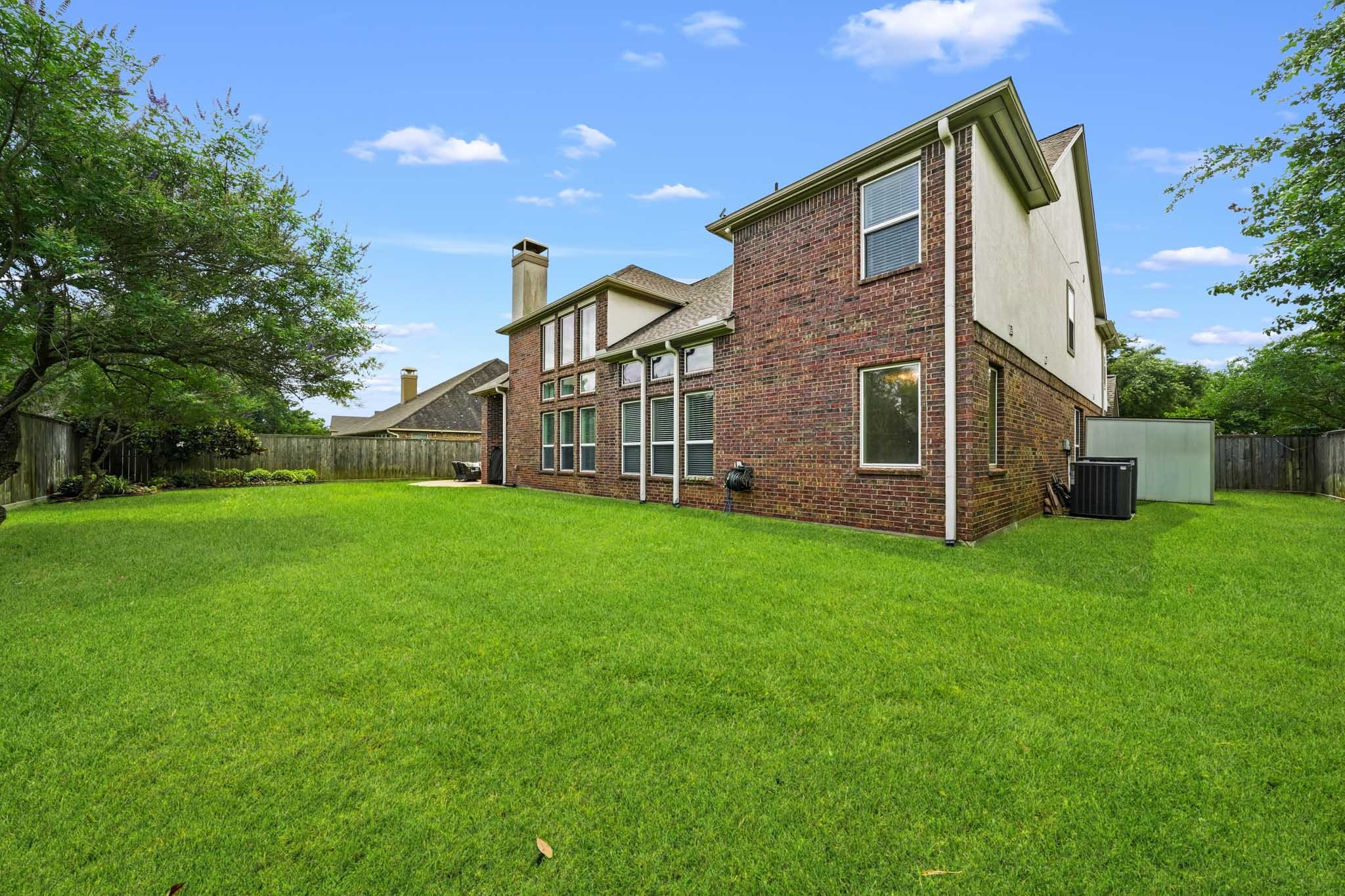 17610 Strackfield Lane Tomball, TX 77377 - Photo 47 of 50 With an abundance of open green space, this remarkable backyard is perfectly suited for play, gardening, outdoor entertaining, or creating the backyard oasis of your dreams.
