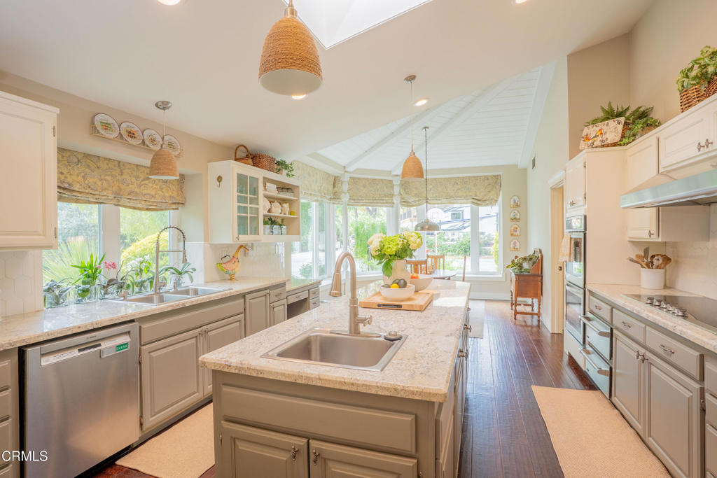 12075 East Pradera Road Camarillo, CA 93012 - Photo 12 of 54 a kitchen with a sink stove and wooden floor