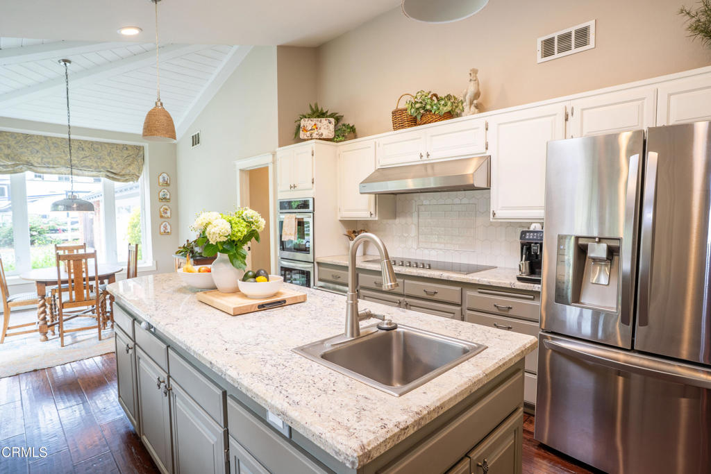 12075 East Pradera Road Camarillo, CA 93012 - Photo 15 of 54 a kitchen with granite countertop a sink a counter space appliances and cabinets
