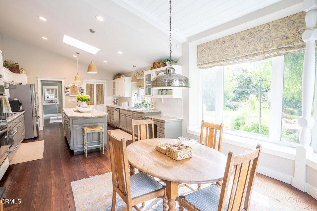 12075 East Pradera Road Camarillo, CA 93012 - Photo 16 of 54 a dining room with furniture a window and wooden floor