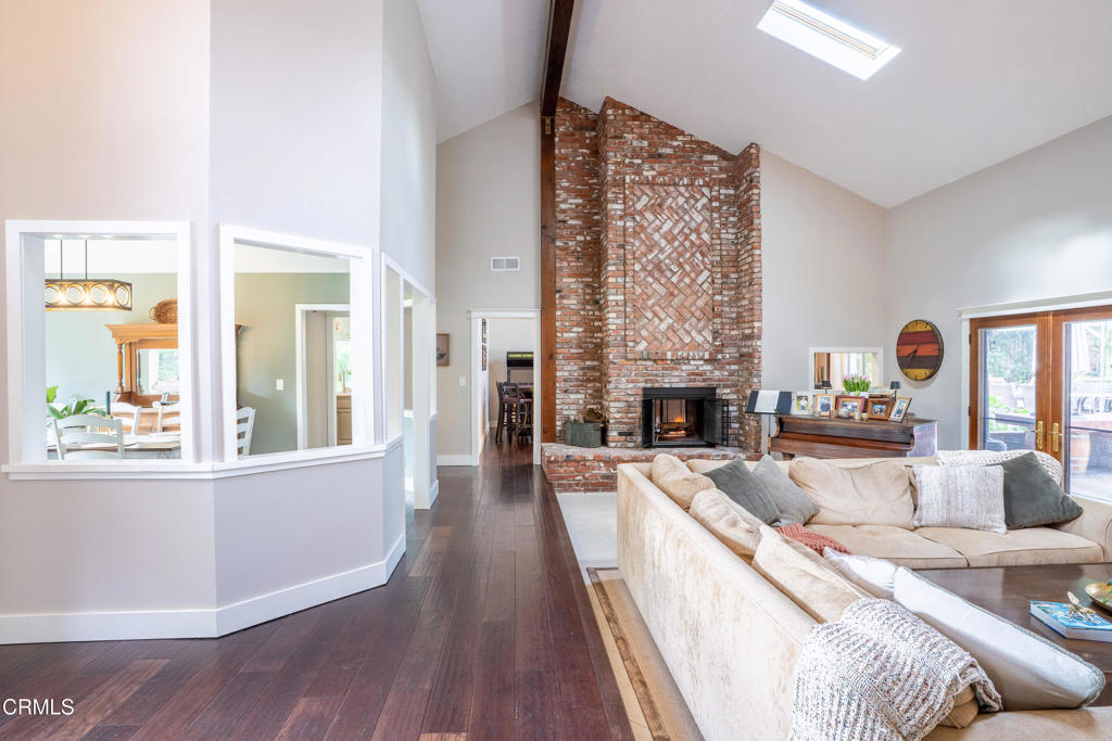 12075 East Pradera Road Camarillo, CA 93012 - Photo 19 of 54 a living room with furniture a fireplace and a large window