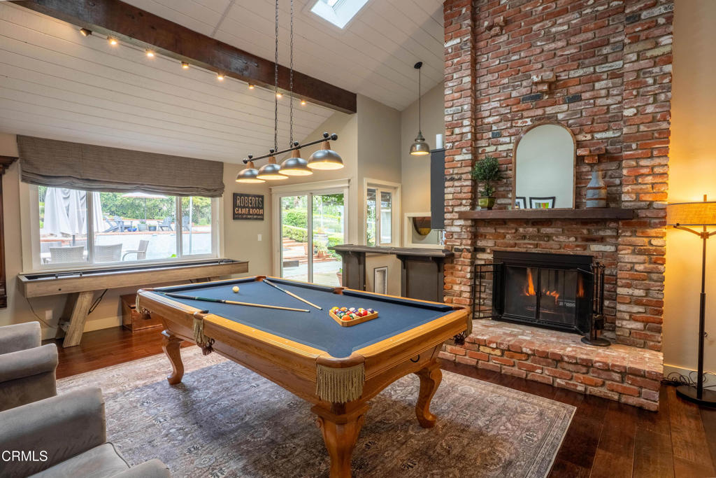12075 East Pradera Road Camarillo, CA 93012 - Photo 20 of 54 a living room with furniture a pool table and a fireplace