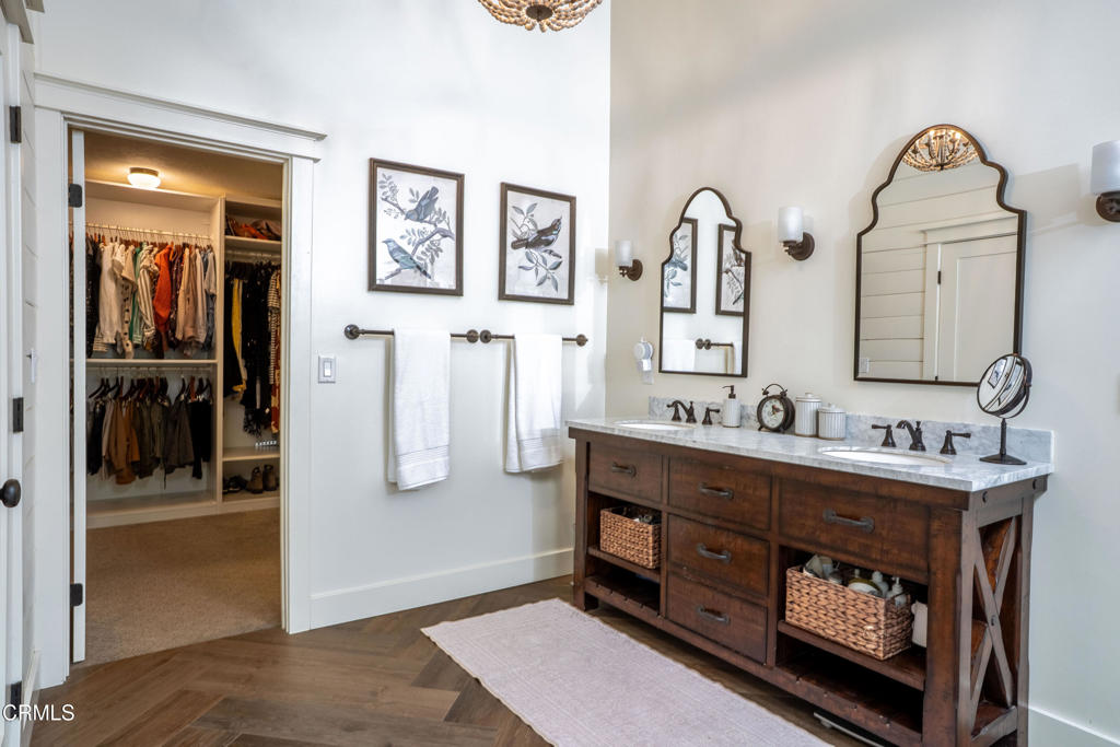12075 East Pradera Road Camarillo, CA 93012 - Photo 30 of 54 a bathroom with a double vanity sink and a mirror