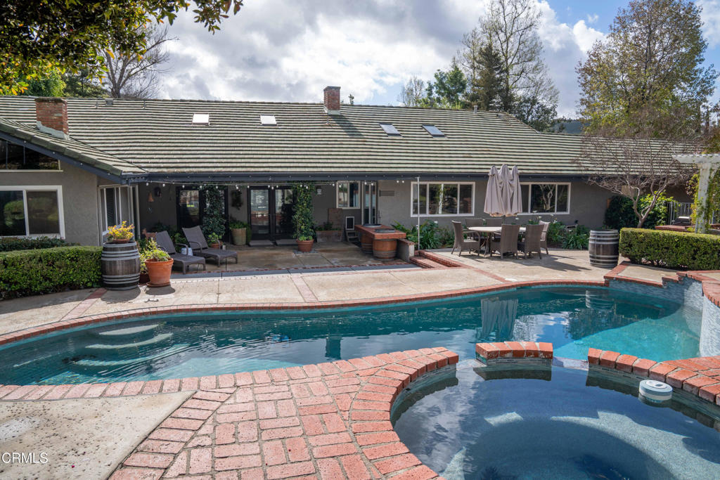 12075 East Pradera Road Camarillo, CA 93012 - Photo 41 of 54 a front view of a house with swimming pool and furniture
