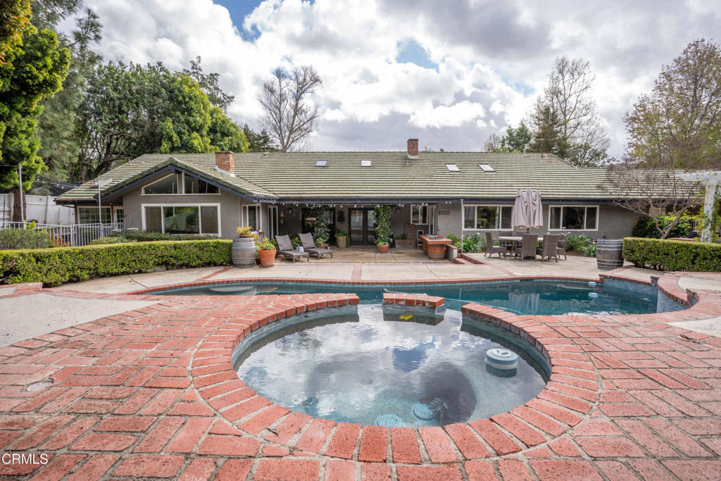 12075 East Pradera Road Camarillo, CA 93012 - Photo 43 of 54 a view of a house with swimming pool and a garden