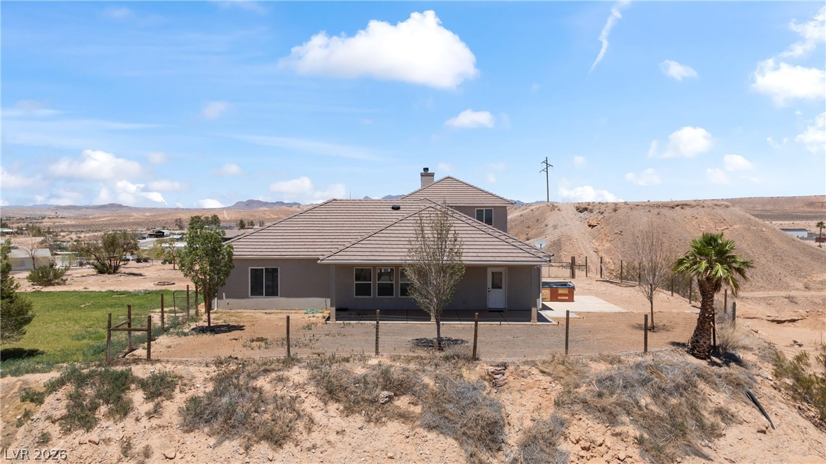 575 Gann Avenue Logandale, NV 89021 - Photo 66 of 75 A desert oasis with a neutral-toned home, offering a quiet retreat with expansive views.
