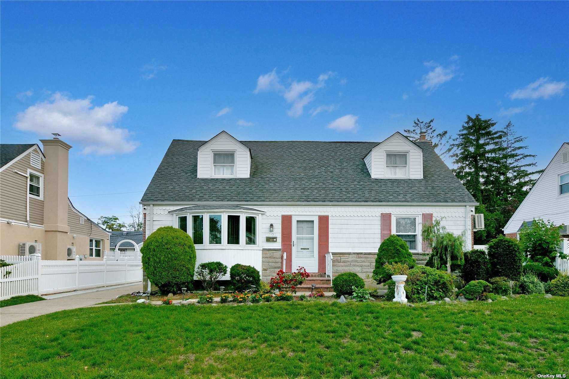 1601 Putney Road Valley Stream, NY 11580 - Photo 1 of 1 a front view of a house with a yard