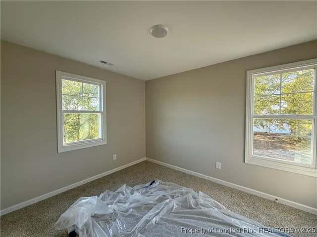 a view of a bedroom with window