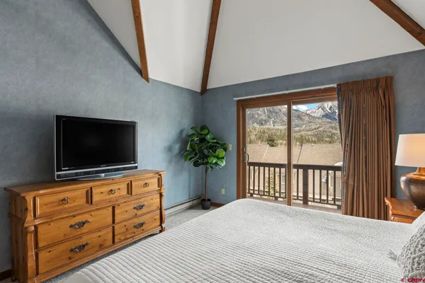 a living room with furniture and flat screen tv