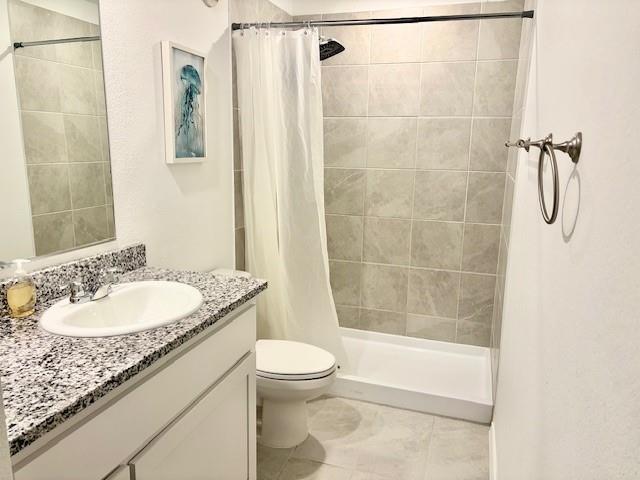 464 Reverie Way Ferris, TX 75125 - Photo 13 of 21 a bathroom with a granite countertop bathtub shower sink vanity and toilet