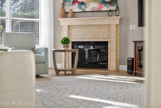 a view of a dining room with furniture large window and chandelier