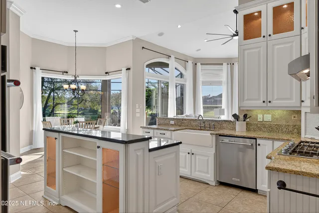 a spacious bathroom with a double vanity sink large mirror and a bathtub