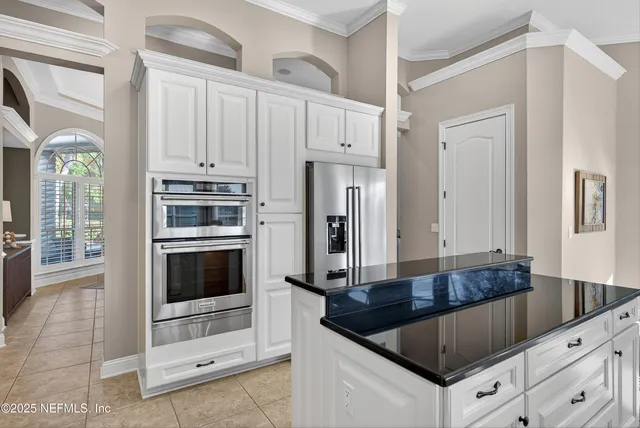 a spacious bathroom with a granite countertop sink a mirror and a