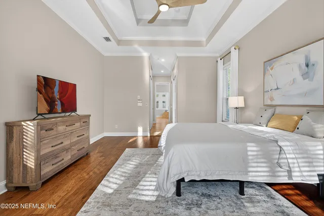 a bedroom with furniture and a window