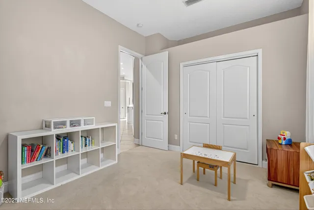 a view of a patio with table and chairs and potted plants