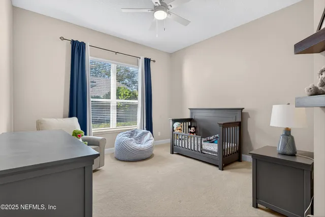 an aerial view of a house with a yard basket ball court and outdoor seating