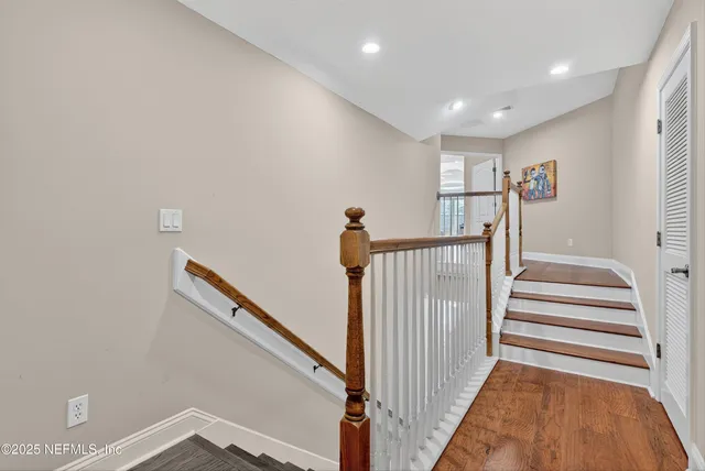 a front view of a house with yard and green space