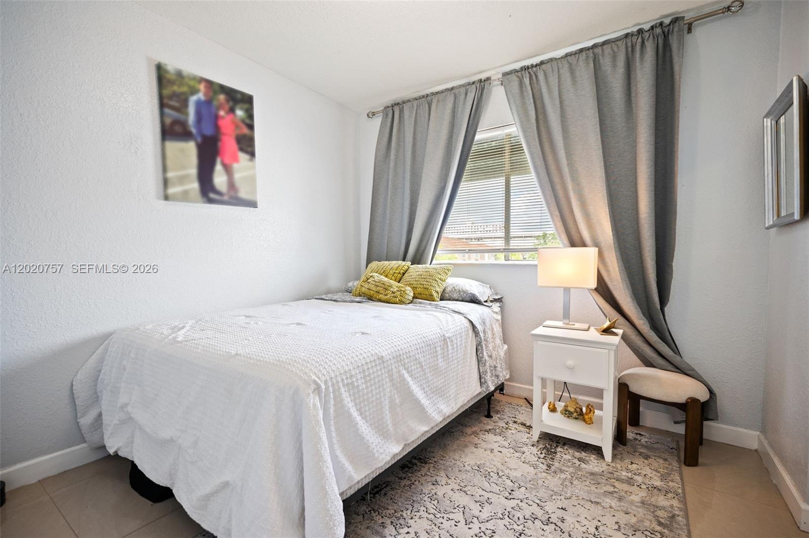 255 East 3rd Street, Unit 1 Hialeah, FL 33010 - Photo 20 of 38 a bedroom with a bed and a window