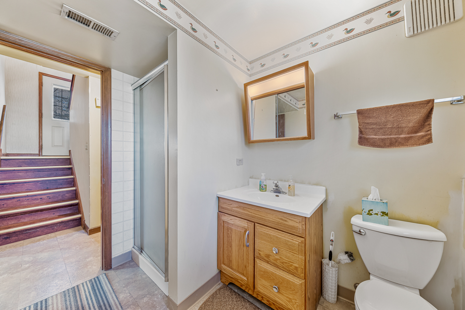 19929 South Schoolhouse Road Mokena, IL 60448 - Photo 13 of 15 a bathroom with a toilet sink and mirror