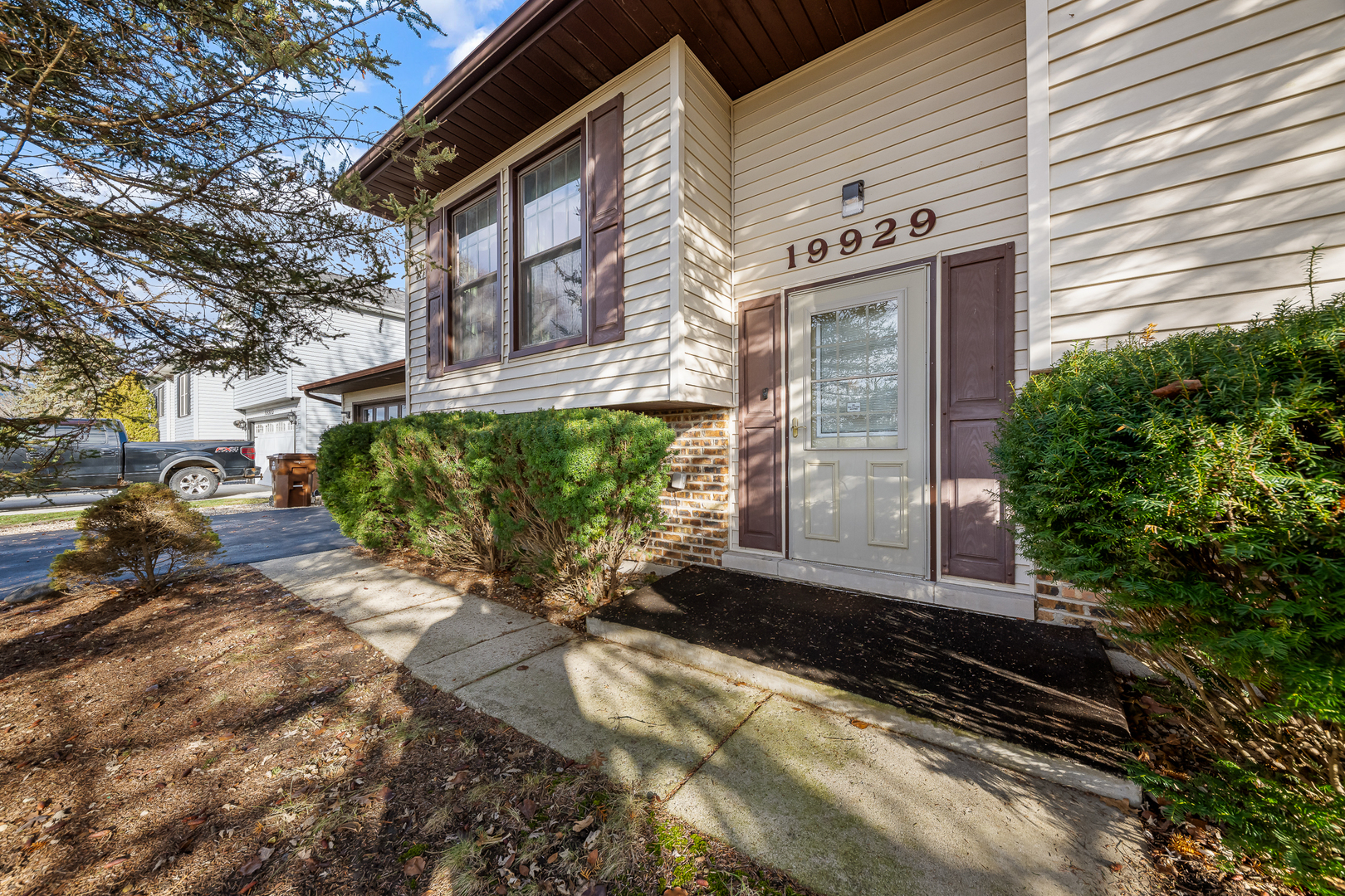 19929 South Schoolhouse Road Mokena, IL 60448 - Photo 3 of 15 a front view of a house with a yard