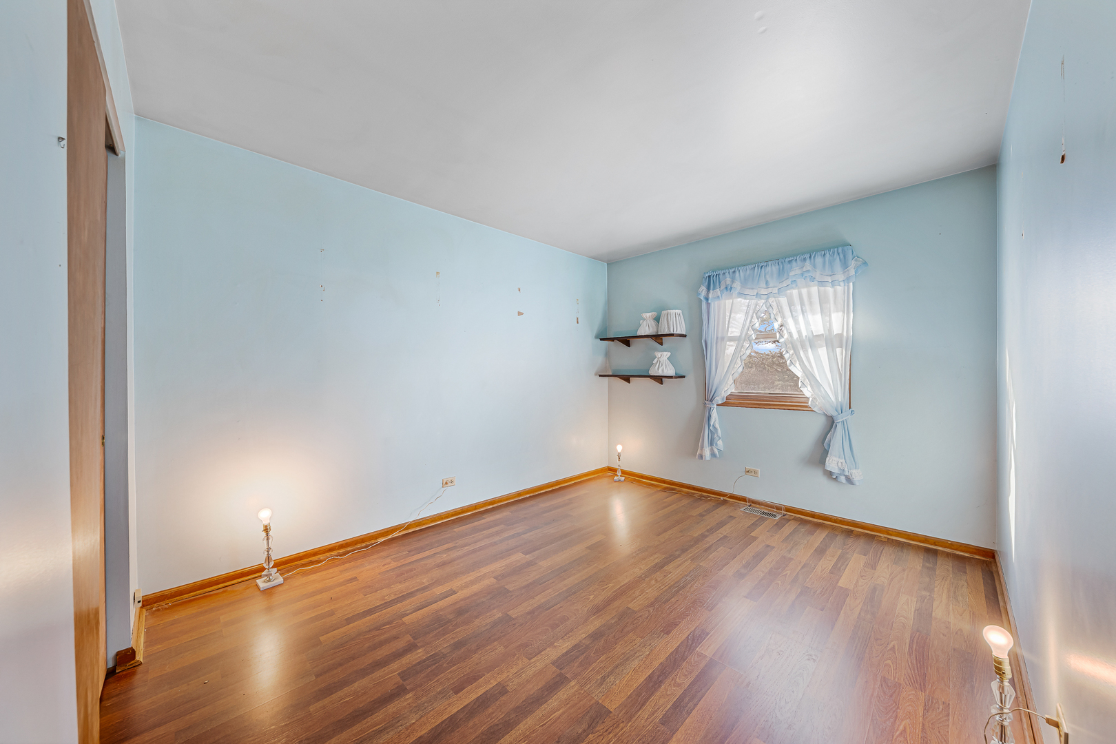 19929 South Schoolhouse Road Mokena, IL 60448 - Photo 9 of 15 an empty room with wooden floor and windows