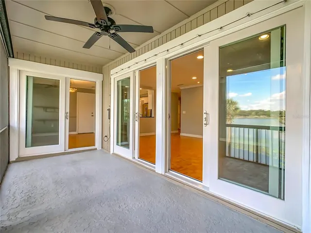 a view of empty room with floor to ceiling window