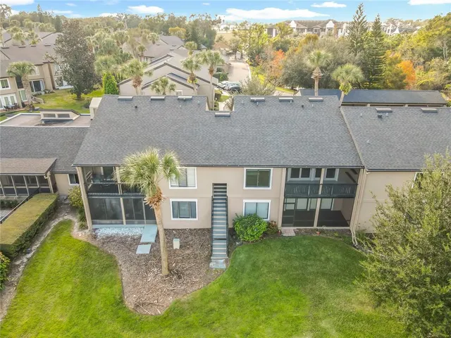 an aerial view of a house with a garden and plants