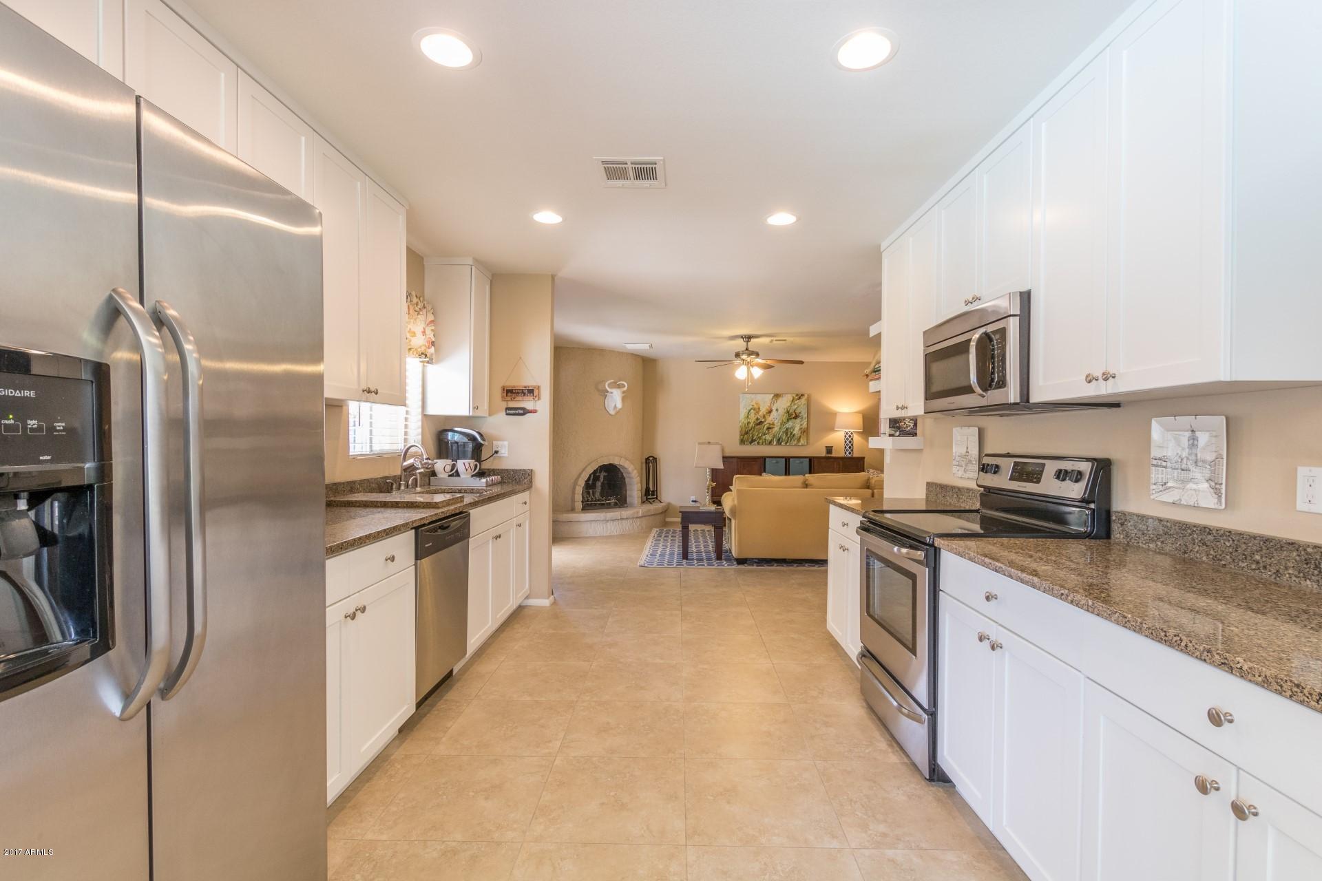 3717 East Yucca Street Phoenix, AZ 85028 - Photo 18 of 36 a large kitchen with stainless steel appliances lots of counter space a sink and a refrigerator