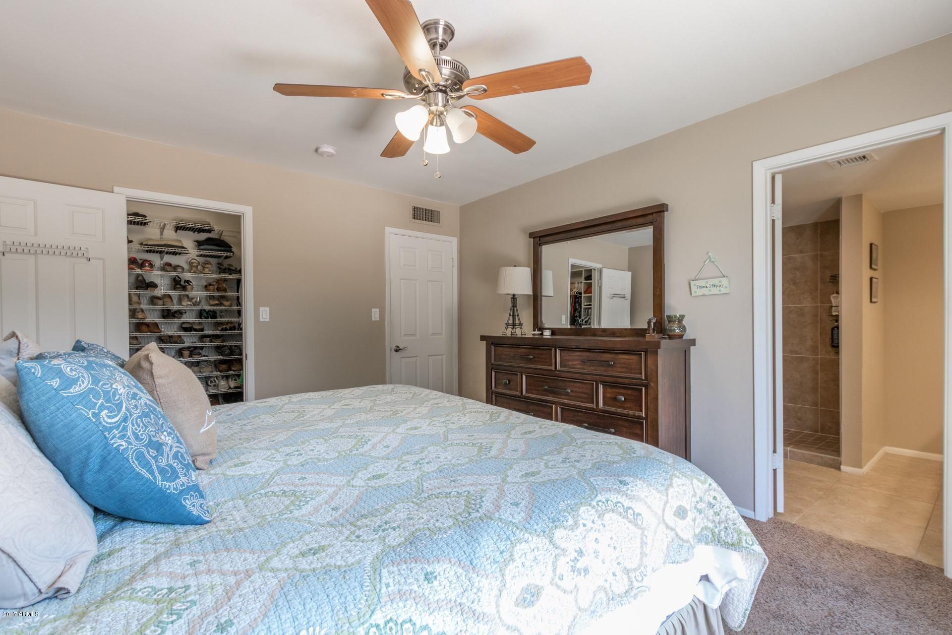 3717 East Yucca Street Phoenix, AZ 85028 - Photo 22 of 36 a bed room with a bed and a television