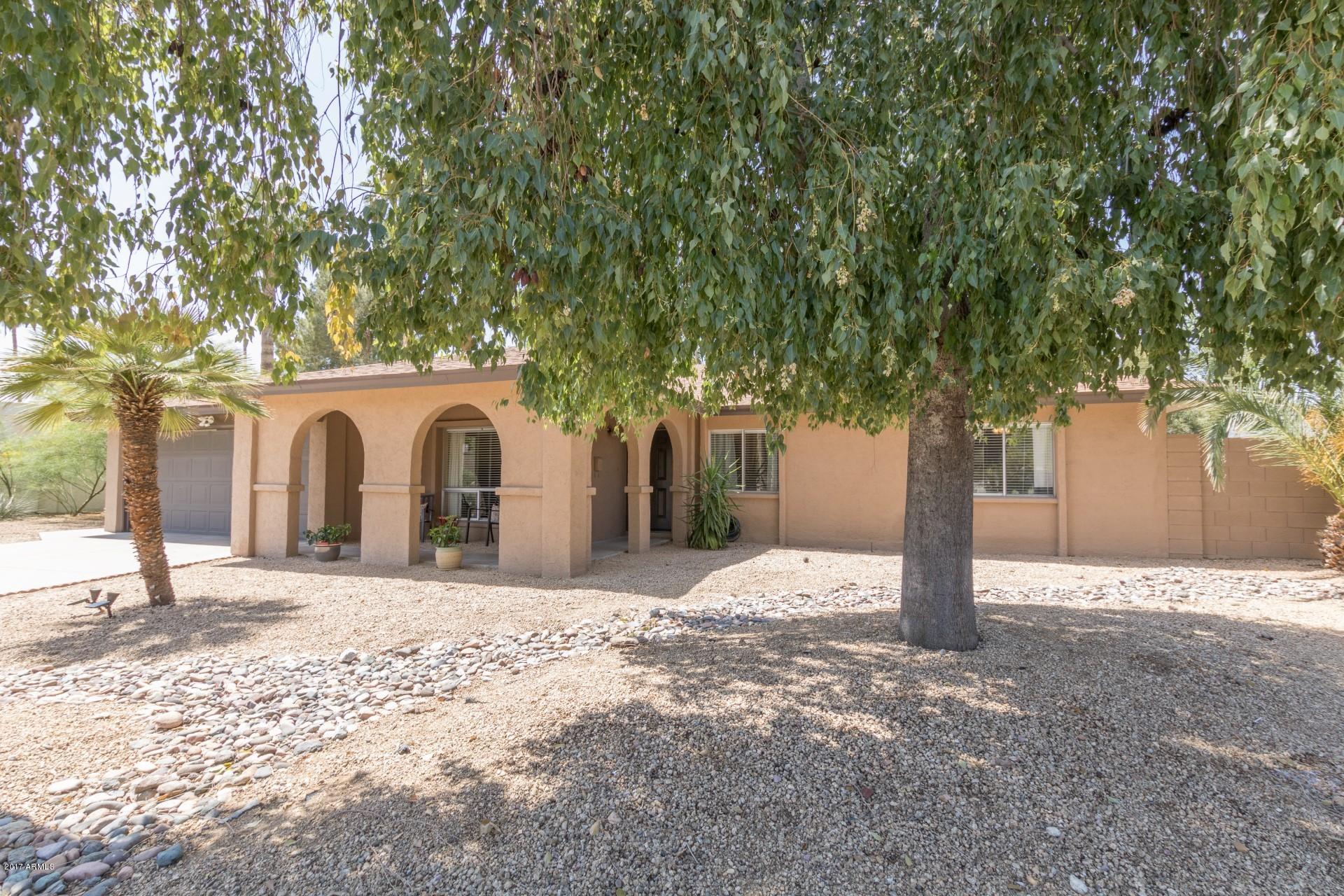 3717 East Yucca Street Phoenix, AZ 85028 - Photo 3 of 36 a front view of a house with a yard