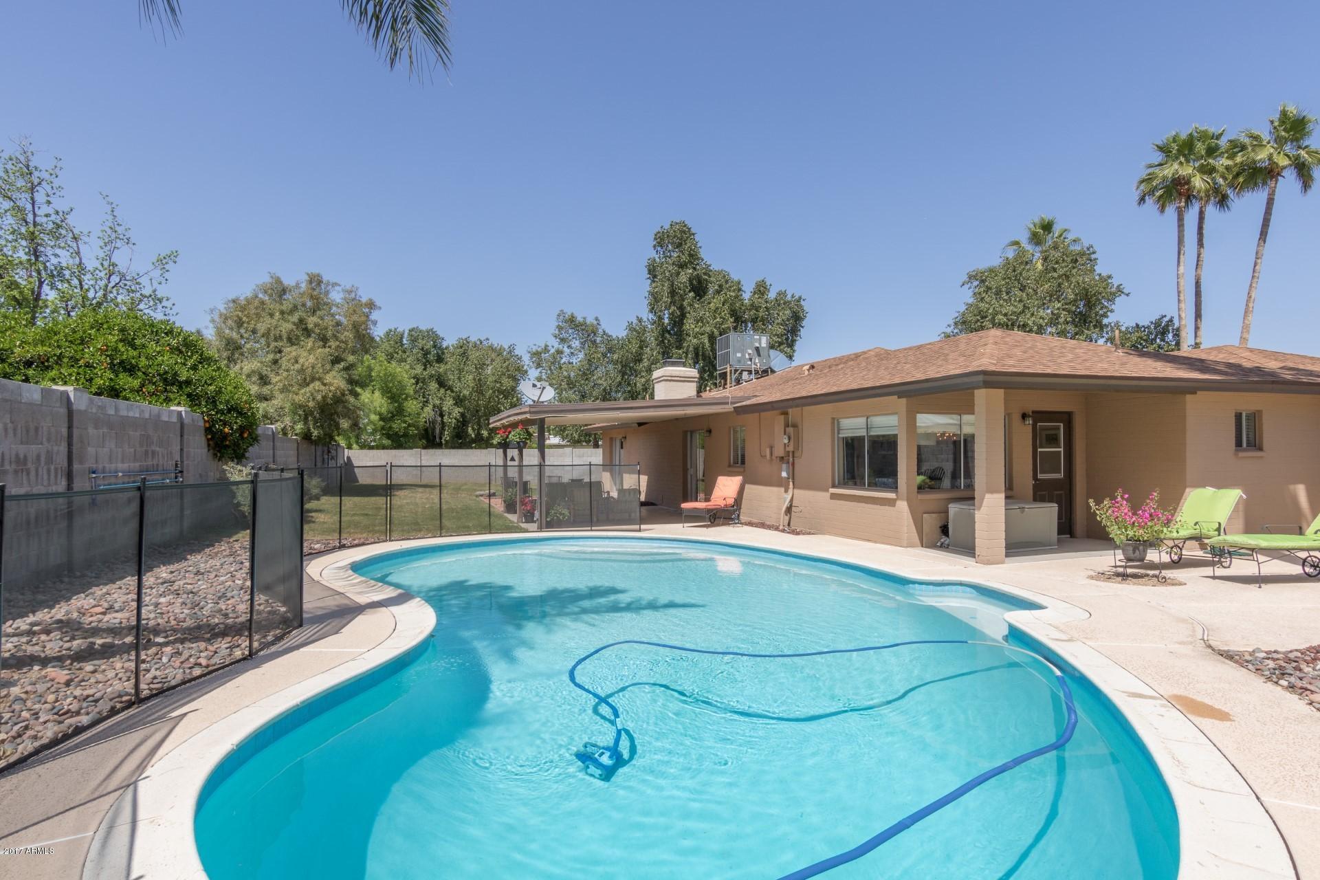 3717 East Yucca Street Phoenix, AZ 85028 - Photo 32 of 36 a view of a house with swimming pool and sitting area