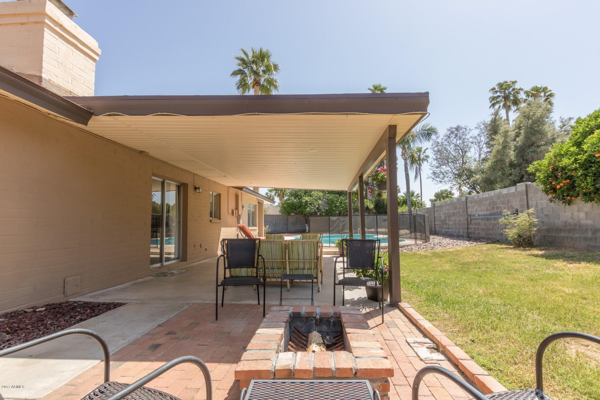 3717 East Yucca Street Phoenix, AZ 85028 - Photo 33 of 36 a view of swimming pool with outdoor seating