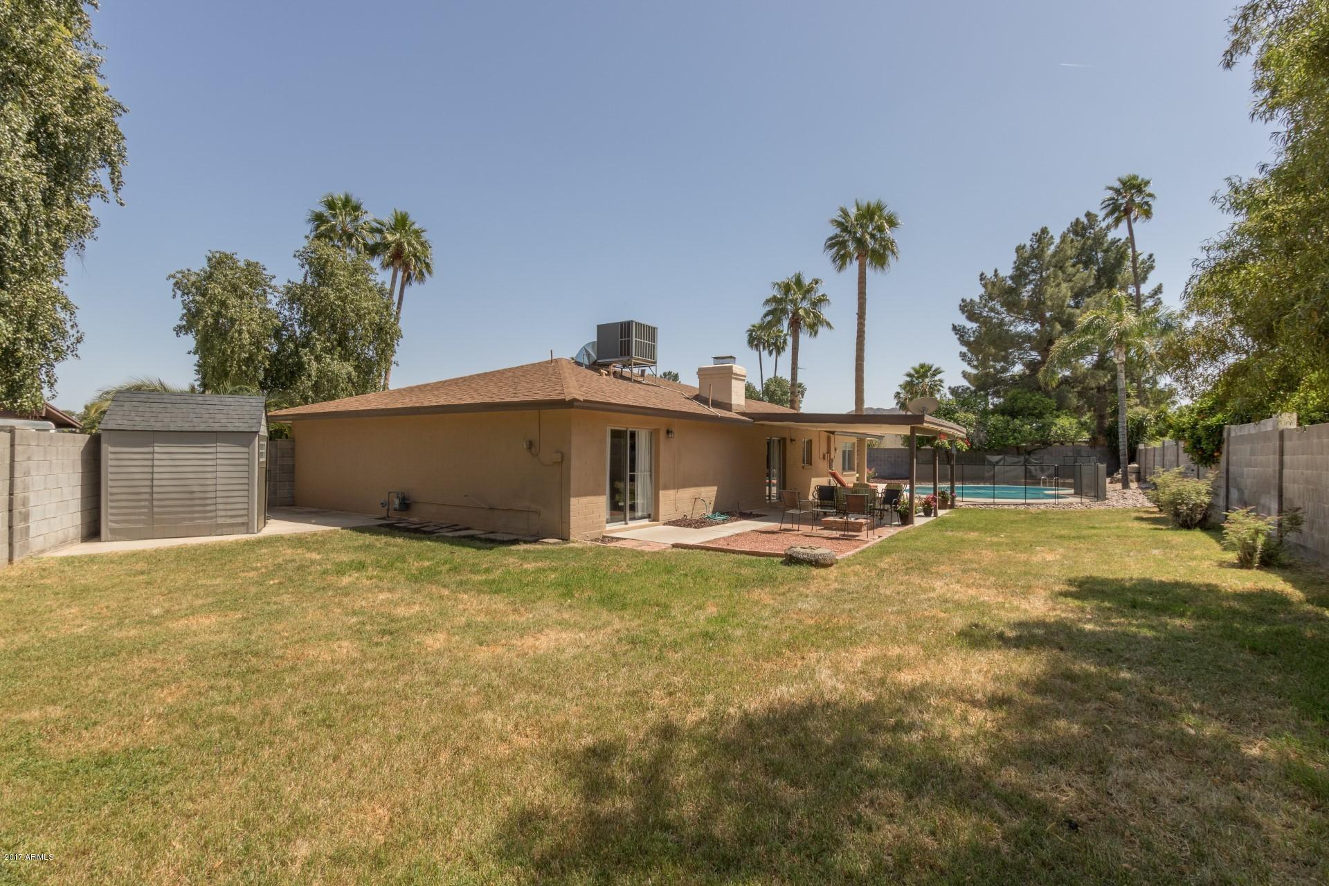 3717 East Yucca Street Phoenix, AZ 85028 - Photo 34 of 36 a view of a house with pool and sitting area