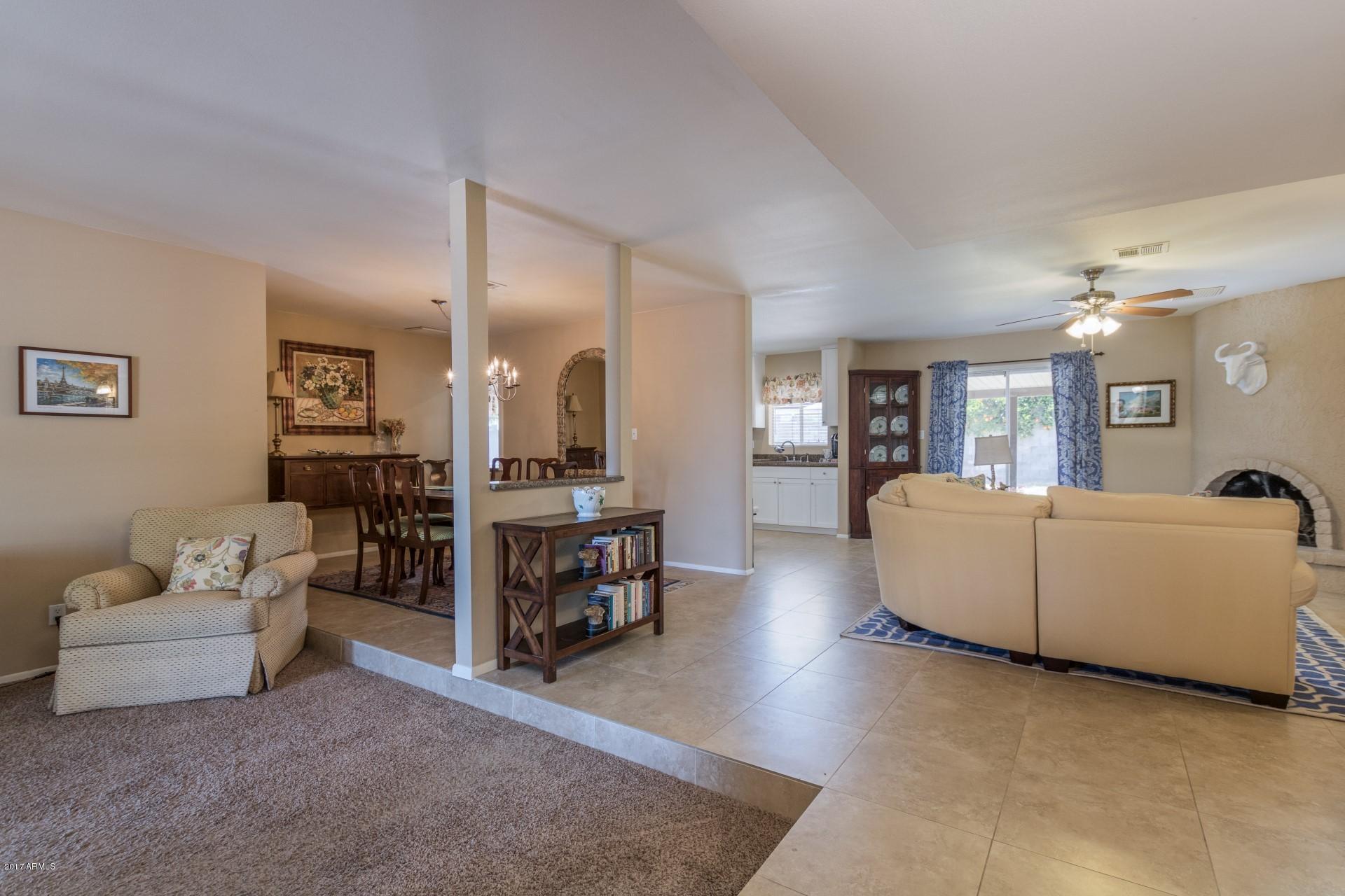 3717 East Yucca Street Phoenix, AZ 85028 - Photo 7 of 36 a living room with furniture and wooden floor