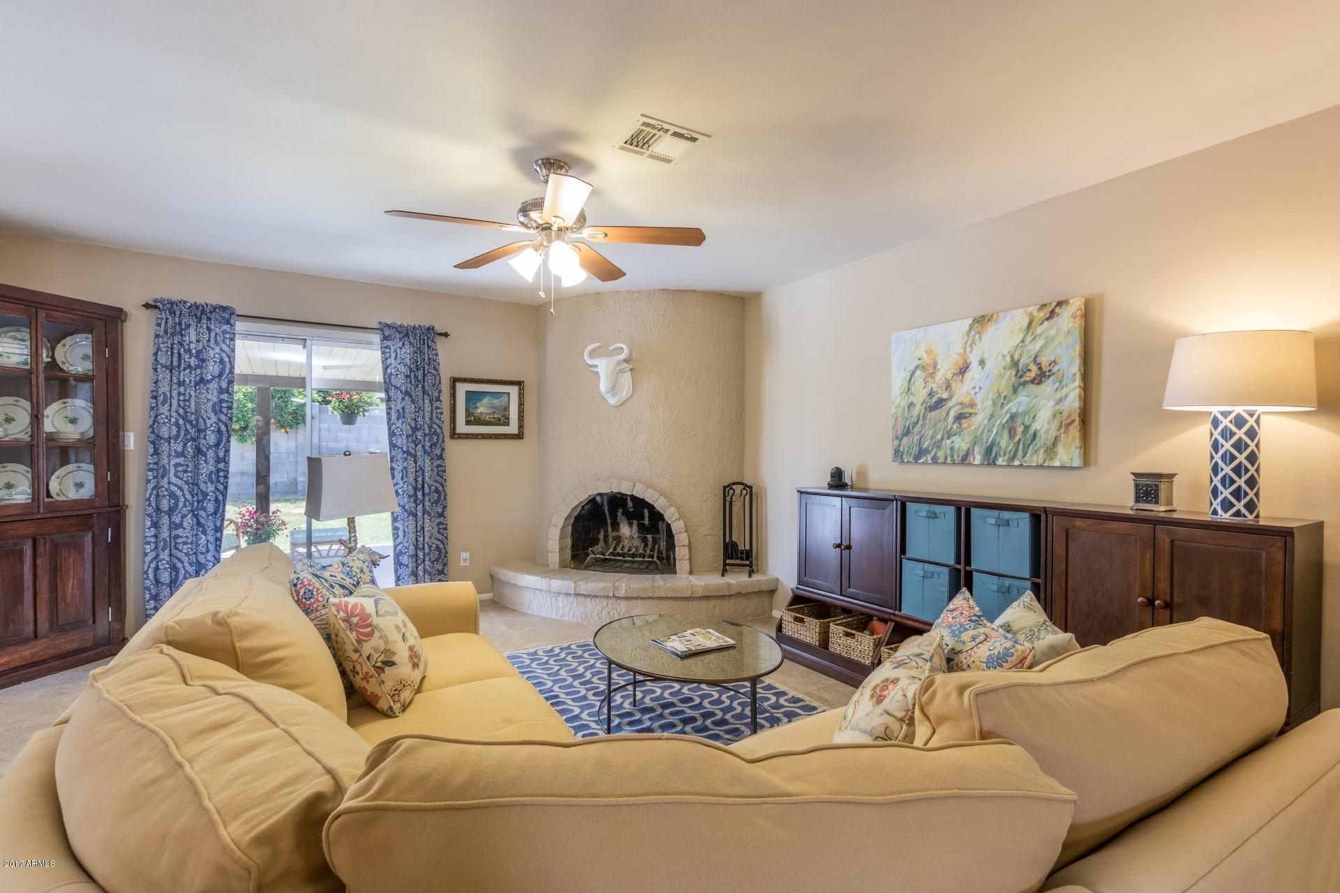 3717 East Yucca Street Phoenix, AZ 85028 - Photo 10 of 36 a living room with furniture and a large window