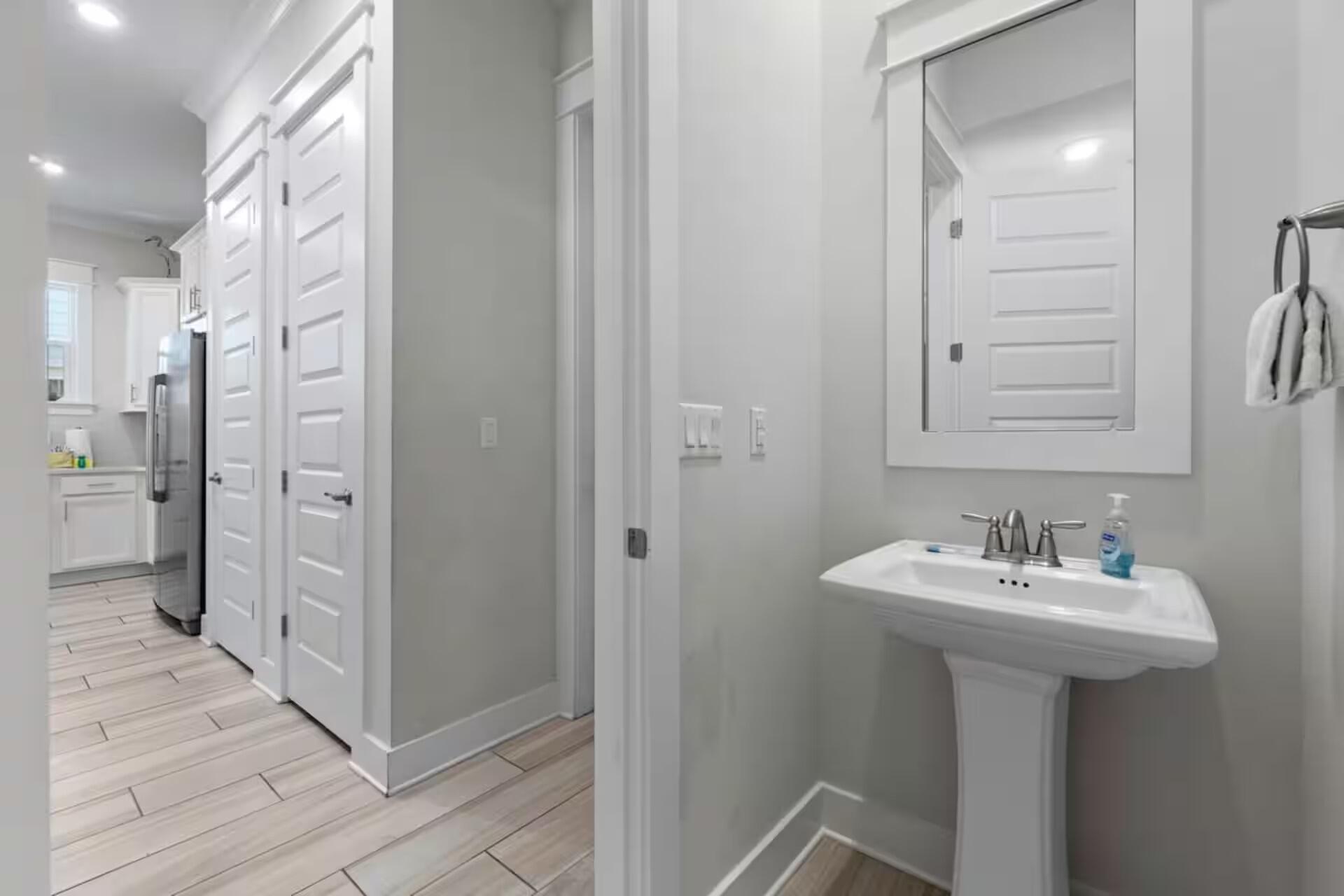 146 East E Pine, Unit B Inlet Beach, FL 32461 - Photo 5 of 47 a bathroom with a sink a mirror and a shower