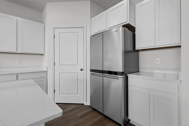 a kitchen with stainless steel appliances a sink stove and cabinets