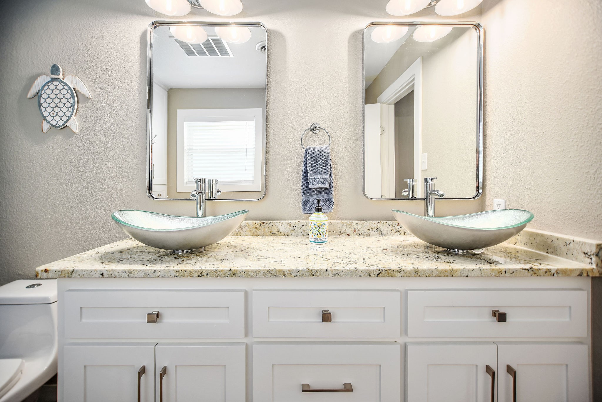 8 Las Brisas Place Port Lavaca, TX 77979 - Photo 32 of 50 a bathroom with a granite countertop sink and a mirror