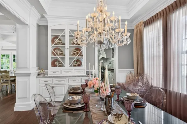 a kitchen with a table and chairs in it