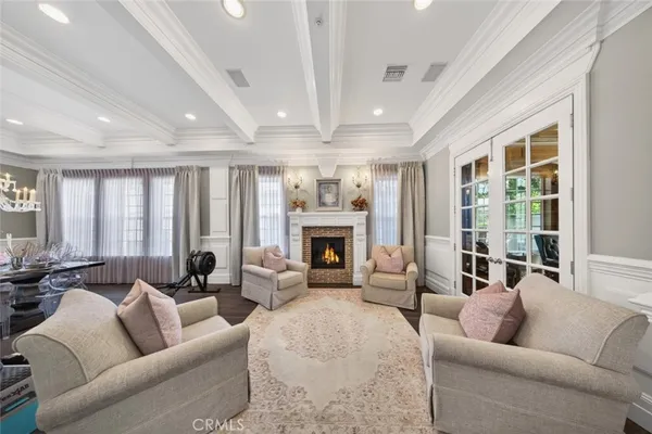 a living room with fireplace furniture and a fireplace