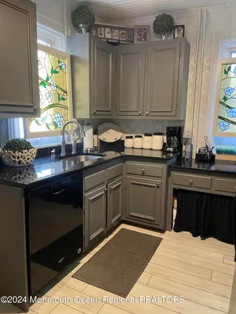 a kitchen with a sink and cabinets