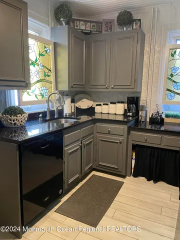 a kitchen with a sink and cabinets