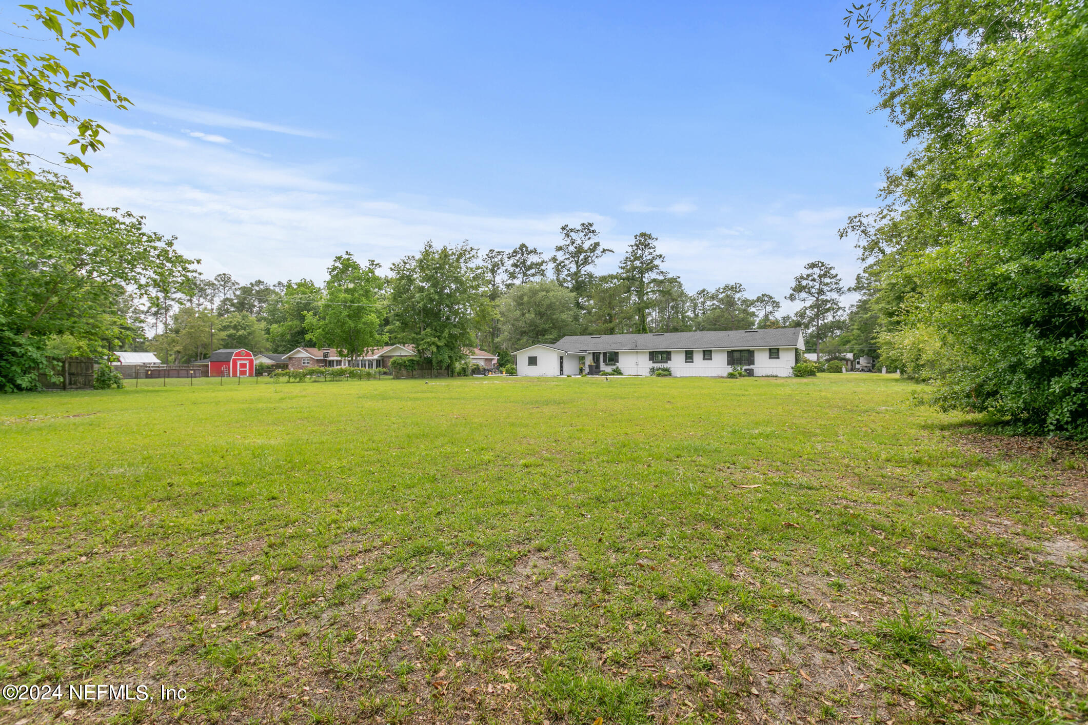 540854 Lem Turner Road Callahan, FL 32011 - Photo 7 of 29 a view of yard with swimming pool and green space