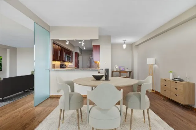a view of a dining room with furniture and wooden floor