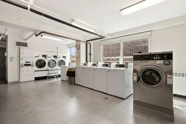 a view of a storage & utility room with washer and dryer