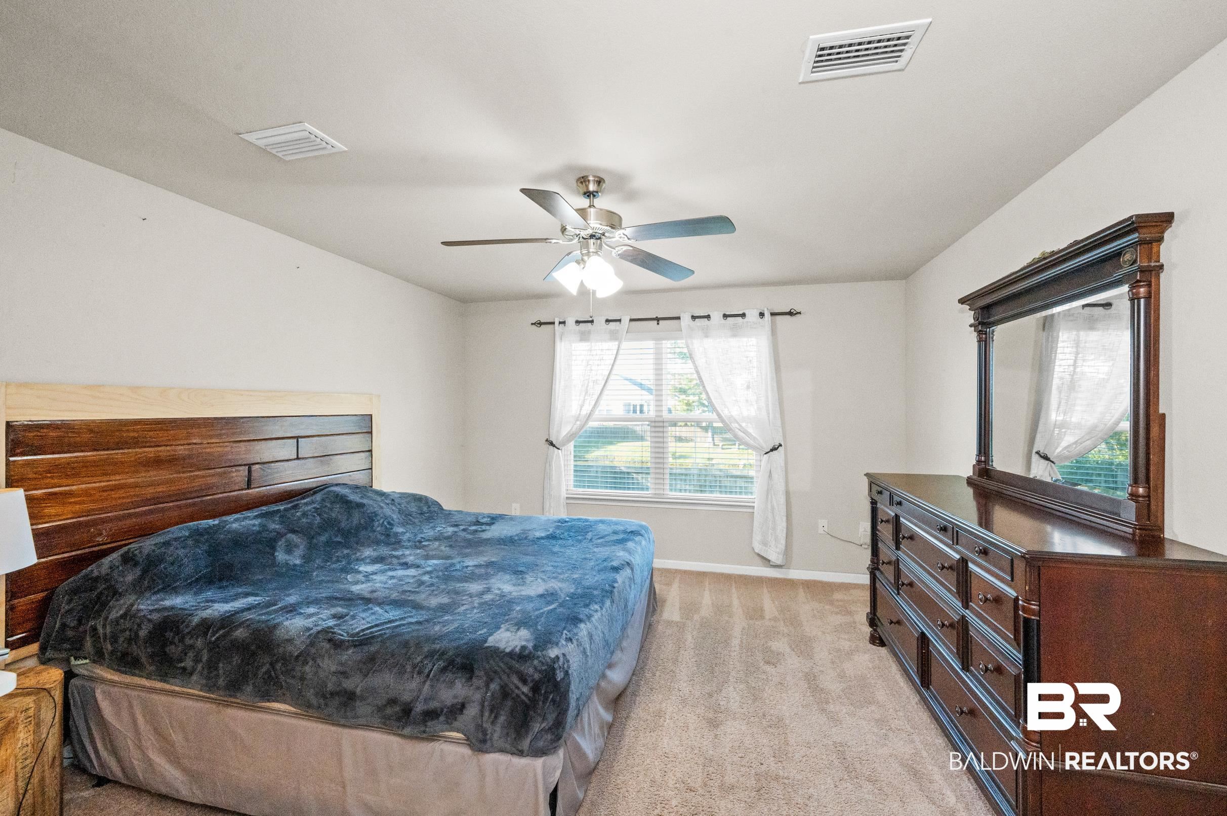 17449 Harding Drive Foley, AL 36535 - Photo 27 of 52 Carpeted bedroom featuring ceiling fan